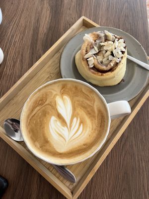 Cinnamon roll and cappuccino with oatly  at My Mom's in Salzburg