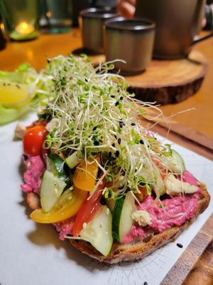 Beetroot hummus toast and green tea in the back at Earth House Restaurant And Wine Bar in Bangkok