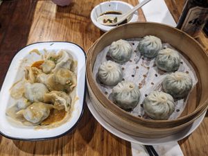 Boiled dumplings with peanut butter and chilli oil sauce/steamed long bao at Shanghai Street - 小籠館 in Melbourne