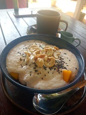 Homemade coconutmilk oat porridge with fruits vegan at Shambhala in Koh Phayam