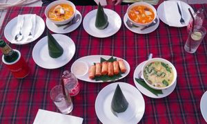 Table full o' curries at KoDam Kitchen in Ao Nang