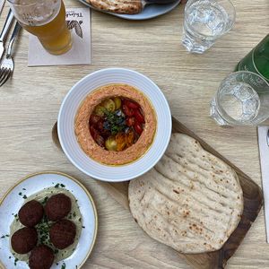 vegan tomato hummus & tomato falafel.. stunning place, 1000s of plants, like an urban garden 🪴  at Twentysix in Budapest