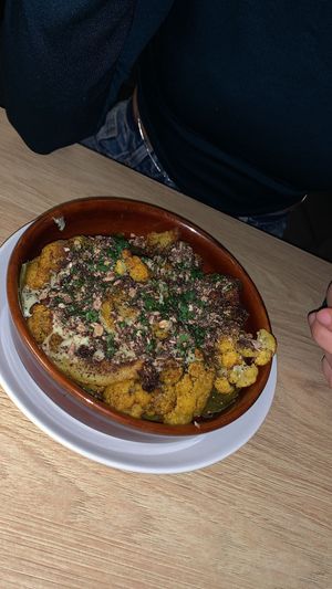 Mezze: Moroccan roasted cauliflower, preserved lemon and parsley tahini, salted chocolate granola, grape leaves  at Twentysix in Budapest