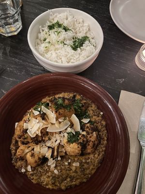 Soy and orange roasted cauliflower, spiced black lentil stew, coconut chips, parsley, rice  at Twentysix in Budapest
