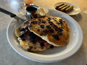 blueberry pancakes and a side of vegan sausages.  at Paradox Cafe in Portland