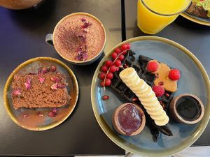 Banana bread, creamy black waffle, and almond milk Açaï hot chocolate   at Açaï & You - Rue Dauphine in Paris