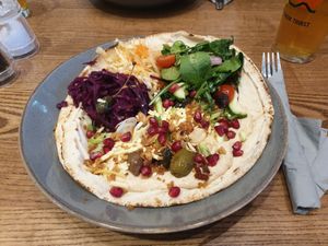 Flatbread with Hummus, Pomegranate, Olives, Toasted Pumpkin Seeds, Vegan Cheddar at The Peddle in Whitehaven
