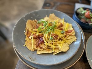 Loaded nachos with jackfruit, vegan cheddar and onions - The Peddle, Whitehaven  at The Peddle in Whitehaven