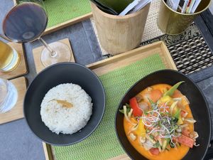 Red Curry with Coconut Milk! So delicious and pretty. You can’t go wrong! They made my husband a Vegan Green Coconut Curry.   at Angkoon in Klagenfurt