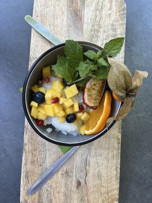 Surprise dessert compliments of the chef-it was so good! Coconut rice with delicious fruits and mint. Patrick, the owner/chef was really great!   at Angkoon in Klagenfurt