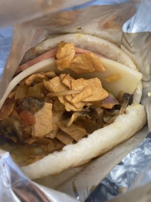 Vegan ham and cheese arepa, to go!  at Marvelous Vegan Plant Power Food in Bogota