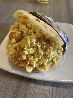 Arepa con tofu scramble and quedó, jamón and chorizo vegano   at Marvelous Vegan Plant Power Food in Bogota