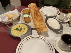 Potato and onion dosa. Idli. Coconut curry. Indian tea.   at Amma's Kitchen in Cincinnati