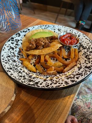 Pros:
Beautiful murals. Instgram-able setting. Good variety on the menu. Clearly marked what is GF.  

Cons:
they were out if rice and fries substituted which are not GF. at Penelope's Vegan Taqueria in Chicago