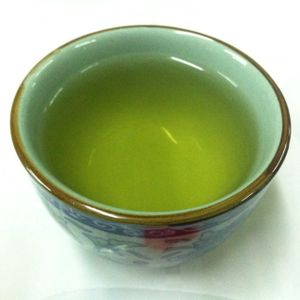 Green tea served while food is prepared at Reunion Cafe in Vientiane