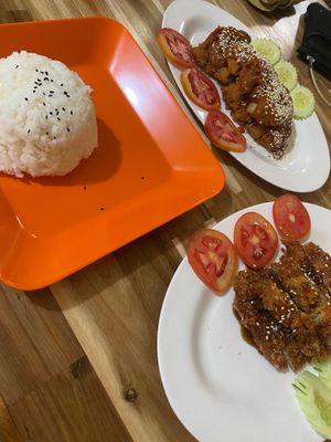 Steamed rice, teriyaki chicken, and peanut chicken  at Reunion Cafe in Vientiane