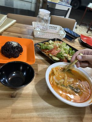 Tom yum soup, black rice and Lao salad  at Reunion Cafe in Vientiane