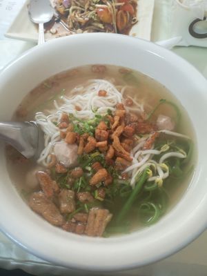 Vietnamese noodle soup with crispy pork 15k kip. Ask for it with fresh mint and Thai basil. Yummy but not super flavourful at Reunion Cafe in Vientiane