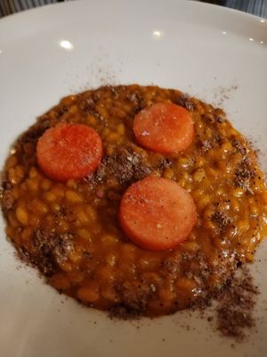Tomato risotto with watermelon and rose powder at Mutty in Castiglione Delle Stiviere
