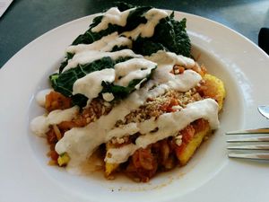 Warm-hearted Pan Seared Polenta with extra sauteed kale - delish at cafegSC in Santa Cruz