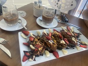 Quinoa waffle, iced coffee with soy milk  at Canttú in Huaraz