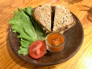 Grilled whole grain toast with tomato sauce at Mi Barrio Cafe in Puebla