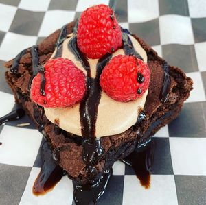 Brownie with Chocolate Frosting, Raspberries, and Chocolate Sauce! at Cinnaholic in Des Moines