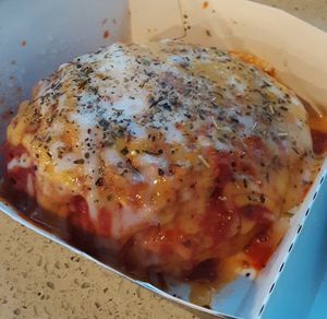 Pizza Roll* - Cinnaholic®'s signature dough rolled w/ savory marinara, Italian seasoning, & [vegan] Mozzarella & Cheddar shreds, topped w/ more sauce & "cheese" (*Seasonal) at Cinnaholic in Des Moines