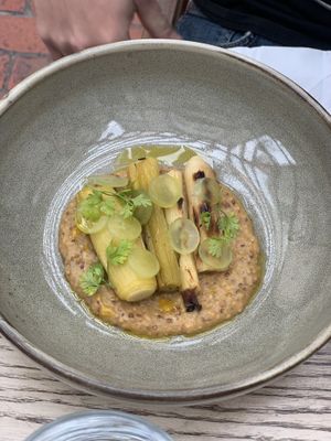 Charred leeks, white grapes, mustard sauce  at Roundhill Restaurant in Brighton