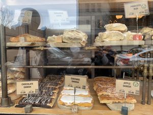 Pastries in window. Vegan options clearly labelled   at 1066 Bakery in Bexhill-on-sea