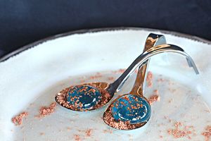 Two "molecular" spheres of Orange or Mint Liqueur. served in bed Vegan Nutella Powder. at Praana Pousada e Restaurante in Nisia Floresta