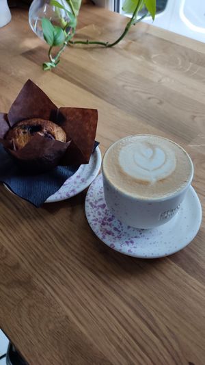 Blueberry muffin and oat milk cappuccino at PlantEat /it/ in Constanta