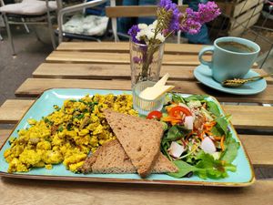 Order this! Scrambled eggs with salad, sourdough bread, butter at Easy Peasy in Berlin