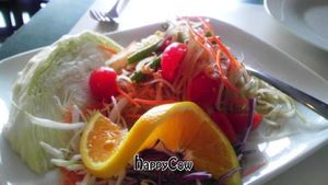 green papaya salad: shredded green papaya, tomatoes, carrots, and green beans in a lemon dressing at Charm Vegan in South Pasadena