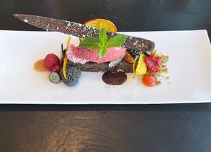 dessert: chocolate brownie, sorbet, berrys, pistachios, peanut, blood orange  at Falcon Marktrestaurant in Soelden