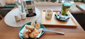 Three mini bread rolls and two savoury spreads (as well as a Tea) are considered a big breakfast. at Green Taste in Innsbruck