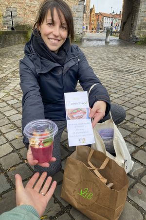 the guide offering a smoothie bowl - you cannot start with an empty stomach :-D at Vegan in Bruges in Bruges