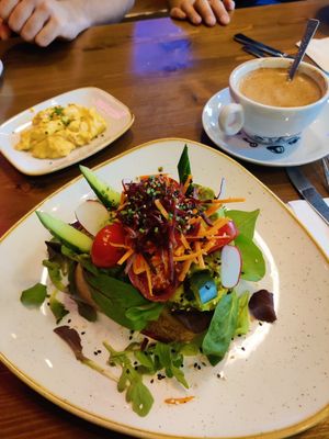 Avocado open sandwich and vegan scrambled eggs at Steel Vintage Bikes Café in Berlin