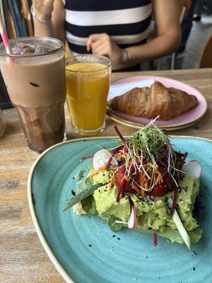 Vegan avocado focaccia, vegan croissant, and vegan ice chocolate.  at Steel Vintage Bikes Café in Berlin