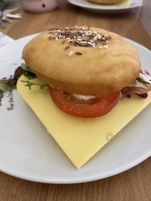 Vegan donut with avocado, vegan cheese, tomato, salad and curry mayo  at La Donuteria in Olomouc