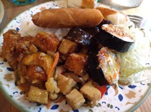 Whatever brunch 3 types of tofu dishes, aubergine dish, kimbap, spring roll, summer roll, rice and cabbage. at Whatever in Tampere