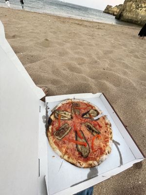 Pizza at the beach. Vegetable pizza with vegan cheese   at KISA'  in Lagos