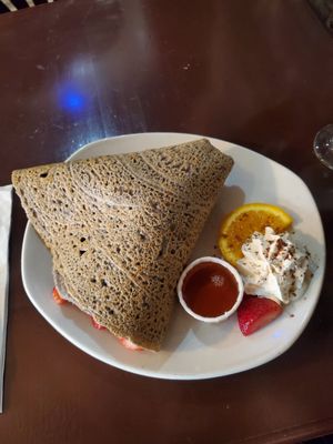 Buckwheat crepe with strawberries and maple syrup. Whipped cream is not vegan. at Le Casse-Crêpe Breton in Quebec