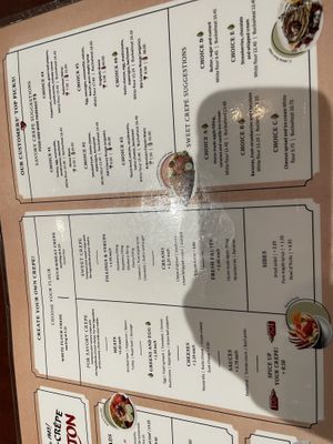 partial menu in English, complete with phone shadow  at Le Casse-Crêpe Breton in Quebec