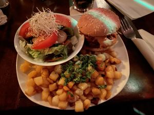 Vegan Boheme Burger with fried potatoes and salad with oil & vinegar dressing (vegan alternative for honey & mustard)  at Hotel Galactica in Muenster