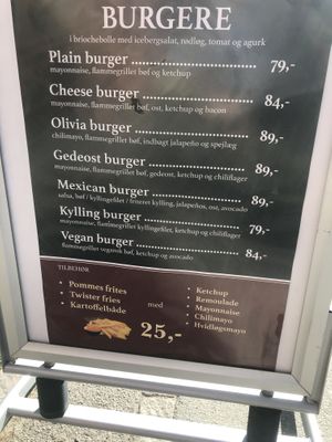Advertisement sign outside: The advertise with their new vegan burger.  at Café Olivia in Vanloese