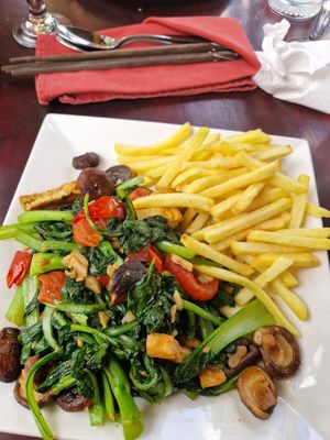 Stir-fried veg and tofu, chips instead of rice at Ladybird Restaurant Hotel Cafe in Lao Cai