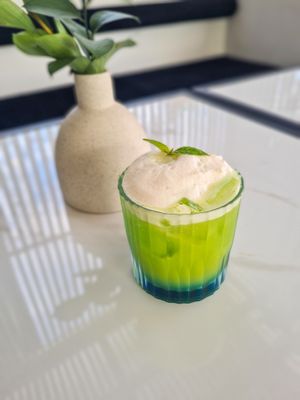 Saucetree Smash - Saucetree signature mocktail. Mixed with basil, cucumber, syrup, orange juice and lime juice with apple foam on the top. at Sauce Tree Kuta in Kuta