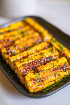 Corn Ribs - Grilled corn with homemade sauce and chilli flakes. at Sauce Tree Kuta in Kuta