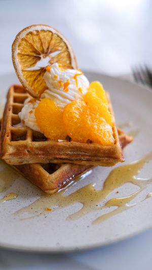 Yuzu Waffle - Oriental yuzu sauce with mandarin orange topped with whipped cream. at Sauce Tree Kuta in Kuta
